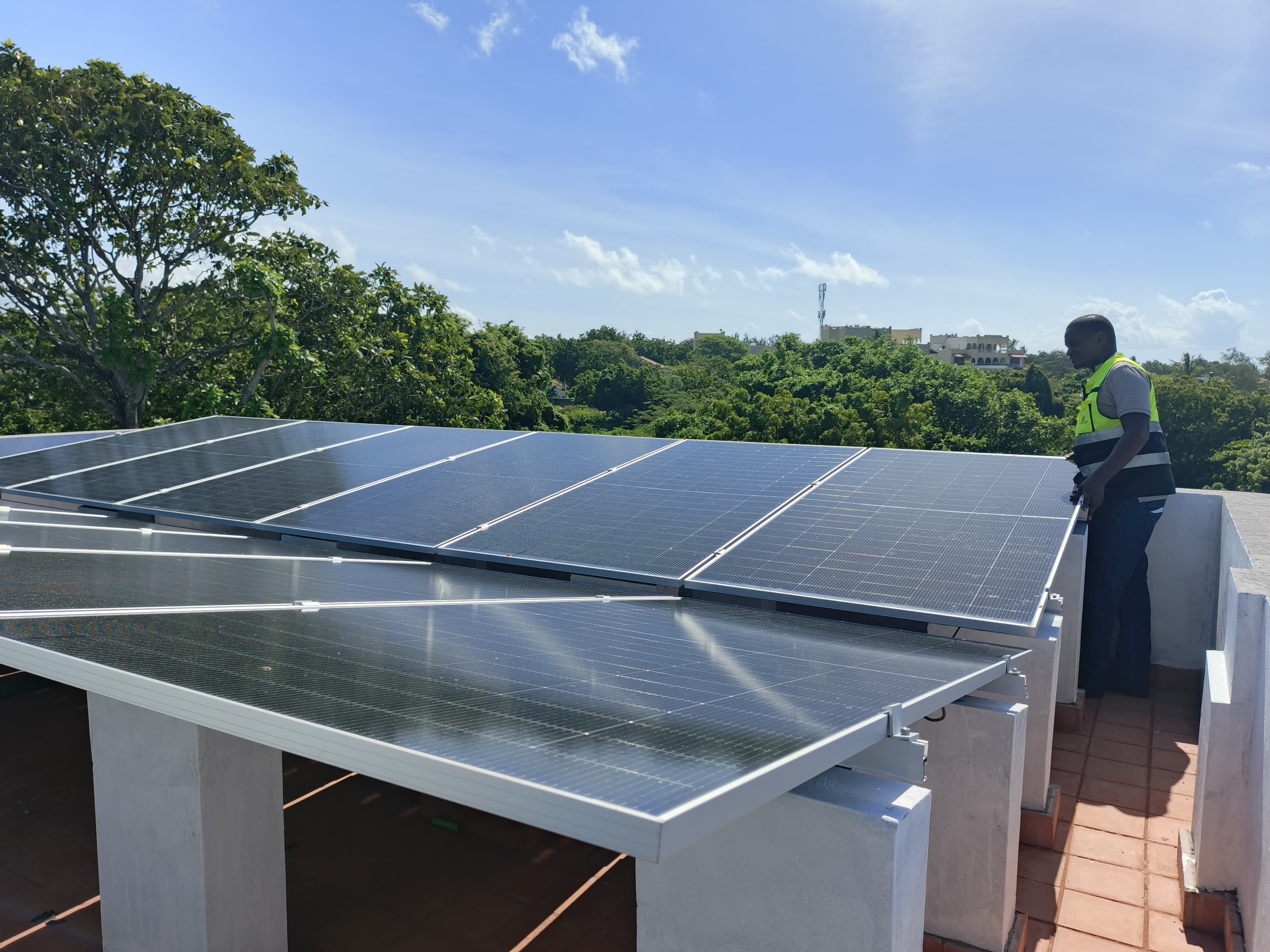 SoluteKK Solar Panel Installation - Professional technician installing sustainable solar energy solutions